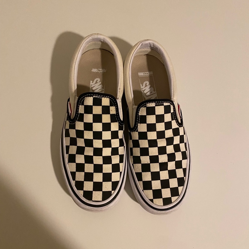 Vans black and white checkered slip on skateboard shoes